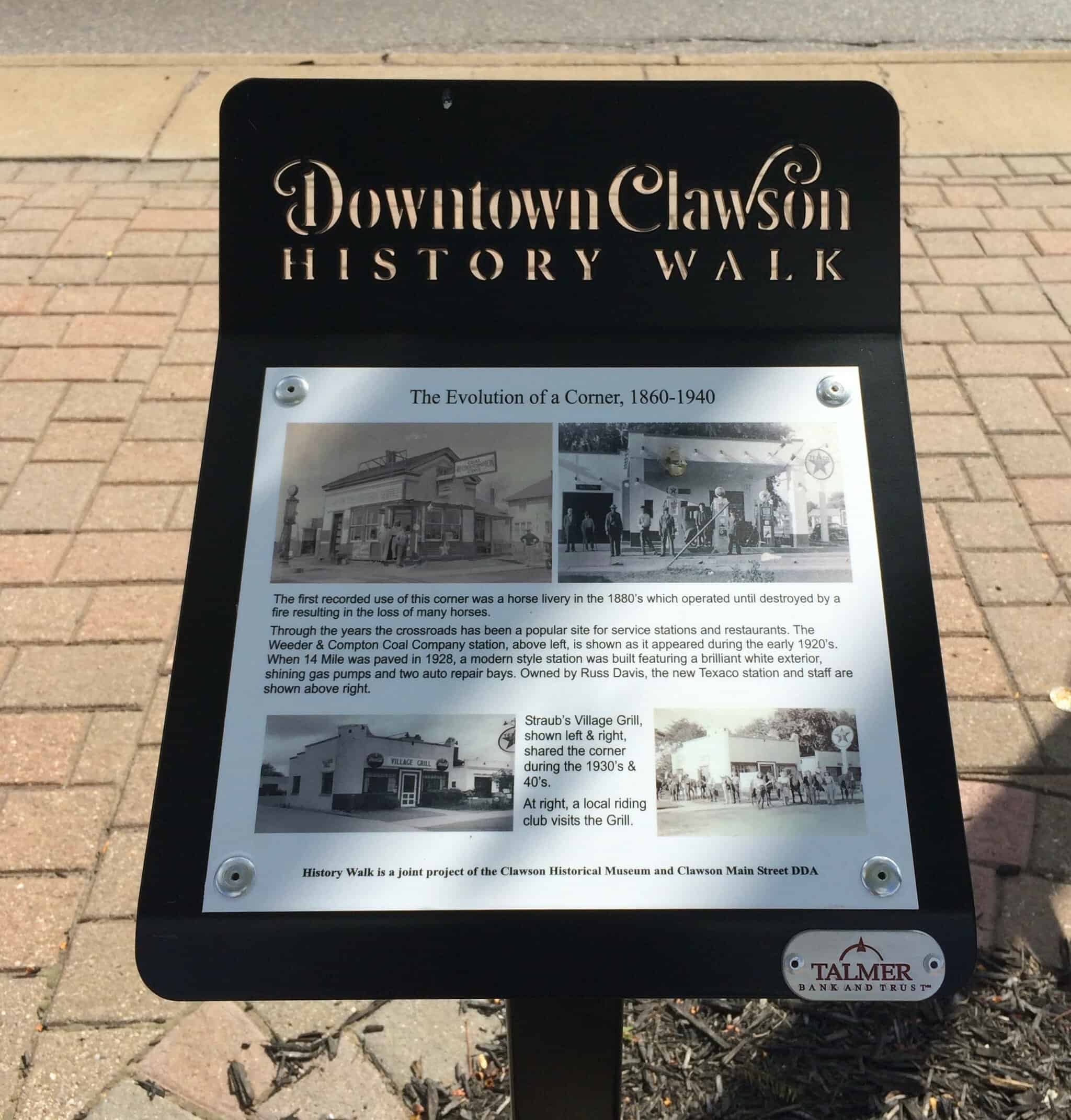 Close up of Downtown Clawson History Walk plaque with historic photos