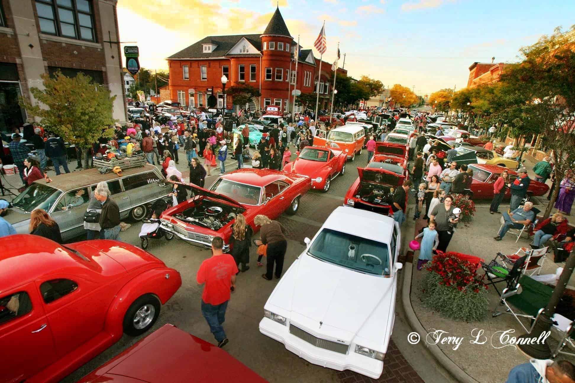 Local Photographer took this shot of the Halloween Holly Car Show, look at all the kids trick or treating!