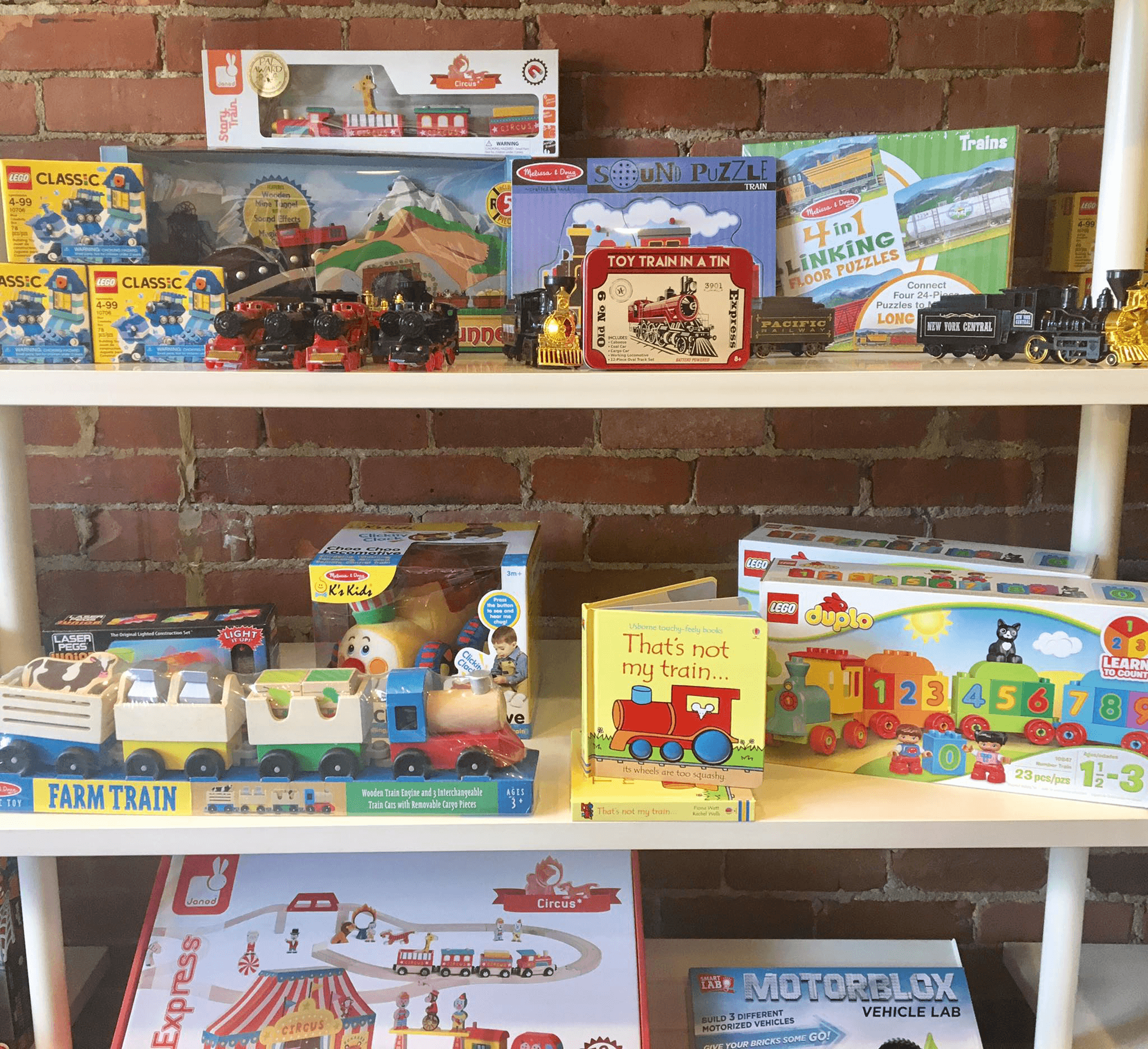 A selection of train themed toys displayed insided Funky Monkey toy store in Downtown Oxford