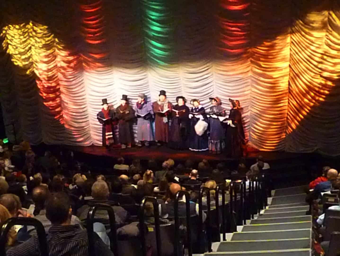 Dickens Christmas Carolers sing to the audience at the Meadowbrook Theatre